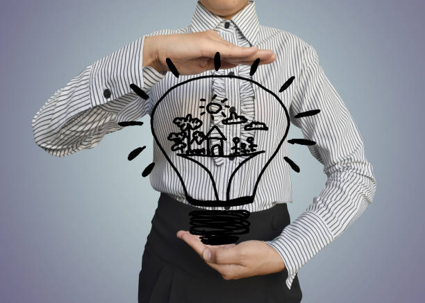 istock Hand woman with drawn Light bulb icon or symbol image with concept of idea( electricity and energy) on grey background. 963036698
