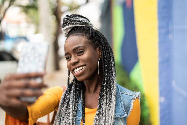 istock Afro Woman Taking a Selfie 963037800