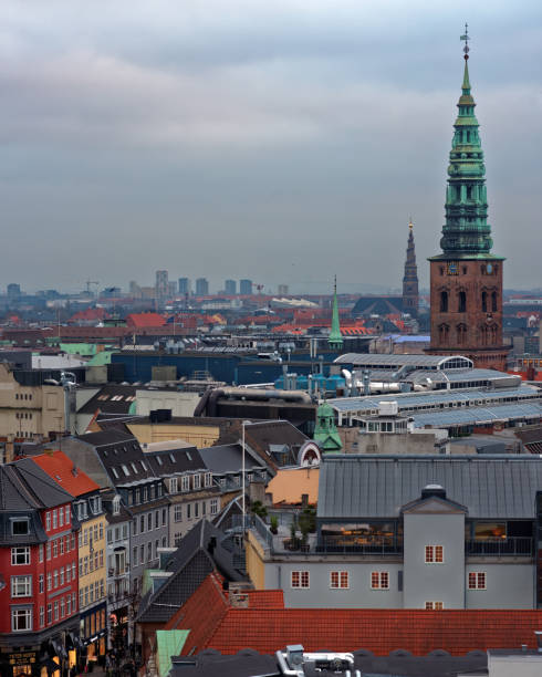 Copenhagen, Denmark - December 29, 2016: Aerial view to the city with the tower of St. Nikolaj Church. Originated in the early 1200s, this Copenhagen's third oldest church now houses the Contemporary Art Center