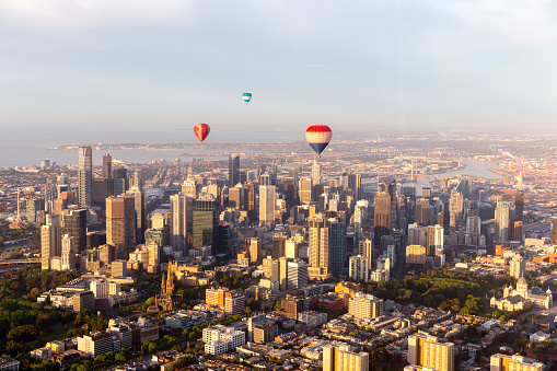 Hot air balloons flying directly past Melbourne, Australia.