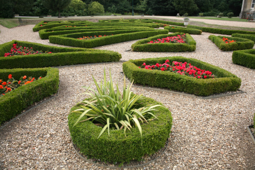 well kept castle garden, maze type hedges & flowers.