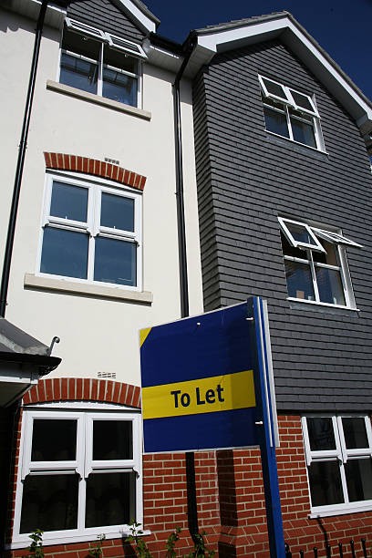 istock A yellow and blue to let sign outside a building 96306639