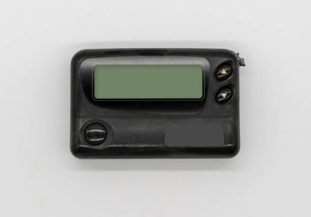 istock Vintage gadget for communication pager. Black pager isolated on white background. Pager with buttons 963081242