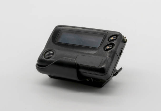 istock Vintage gadget for communication pager. Black pager isolated on white background. Pager with buttons 963081250
