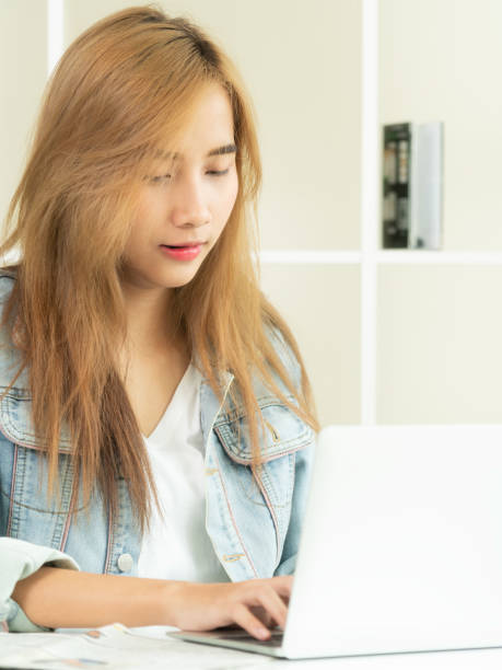 istock Concentrated woman works on computer in home office. 963085068
