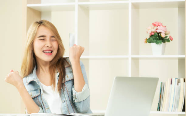 istock Excited young woman showing accomplishments. 963085098