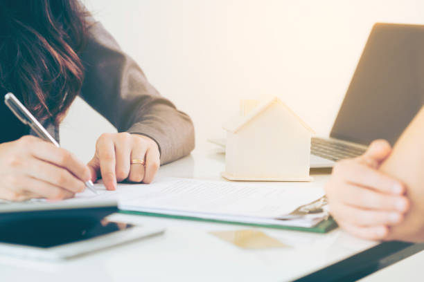 istock Client Signs Document to Buy House and Real Estate 963085158