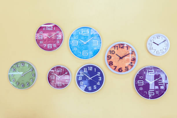 istock Colorful clocks decorated on the wall, vintage background. 963089952