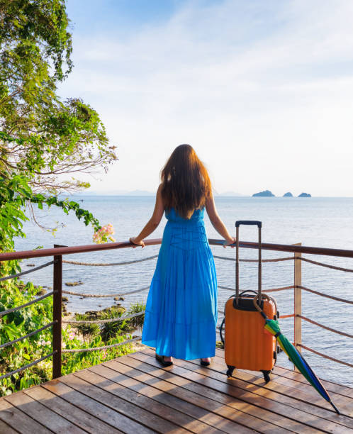 istock Young woman looking at the sea 963089954