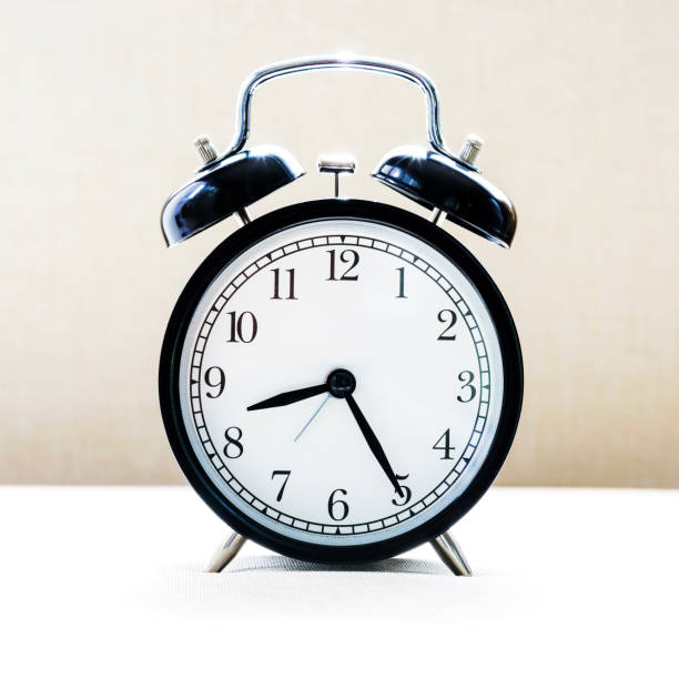 istock Retro alarm clock vintage tone wall background. 963097066