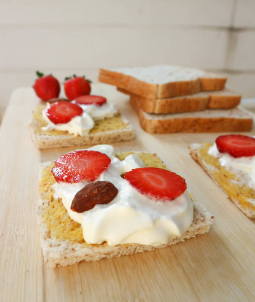 istock whole wheat bread and canape with strawberry 963098568