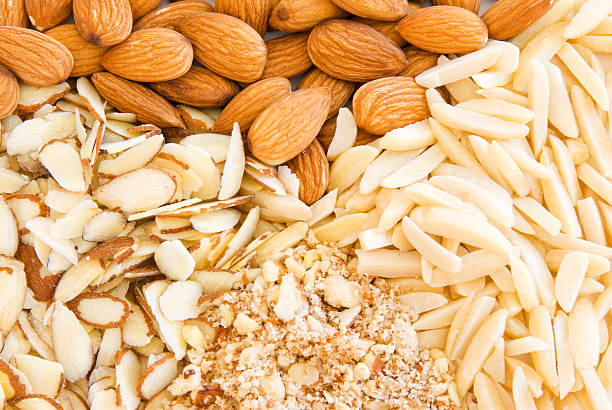 unpeeled and peeled roasted almonds on the same plate
