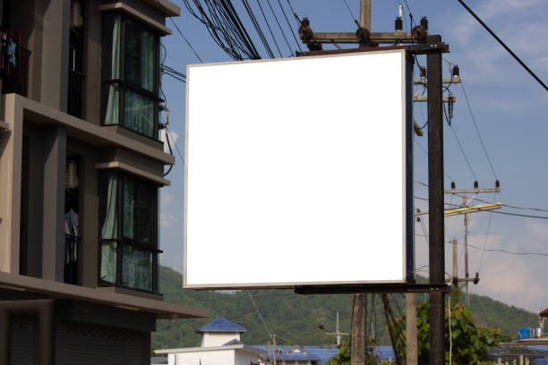 istock White blank billboard or signboard on street side for mock up presentation. 963102296