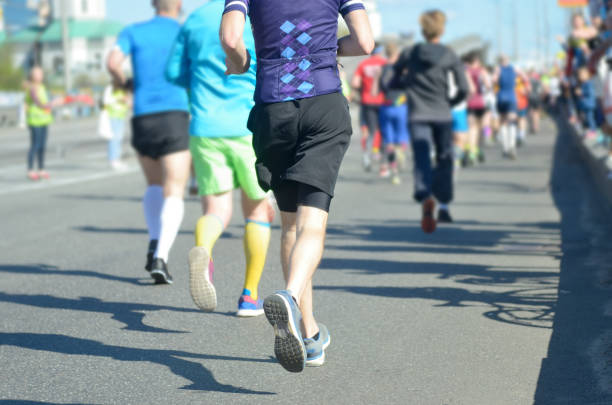 istock Marathon running race, many runners feet on road 963102994