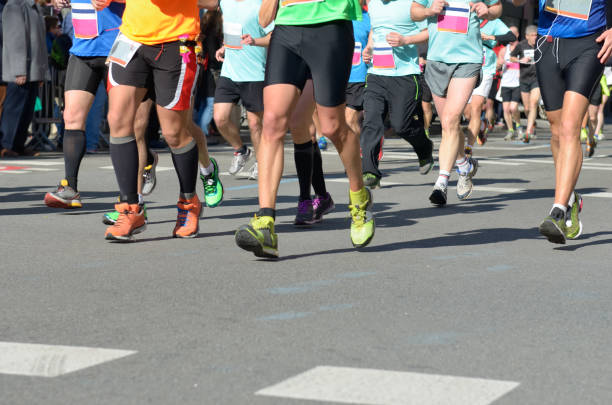 istock Marathon running race, many runners feet on road 963102998
