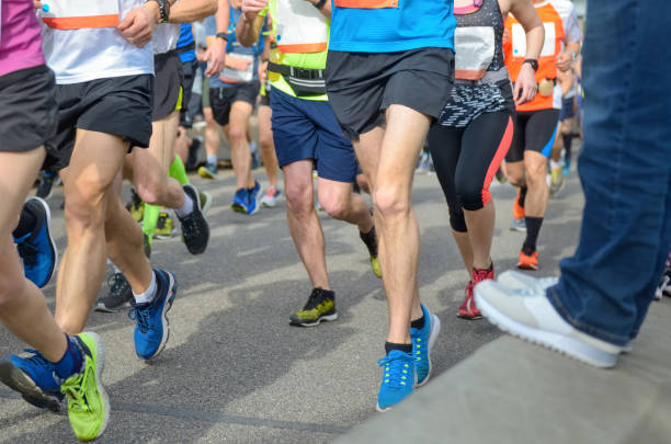 istock Marathon running race, many runners feet on road 963103020