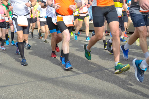 istock Marathon running race, many runners feet on road 963103024