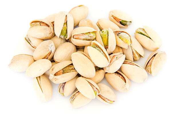 istock Pile of pistachios in shells on white 96310308