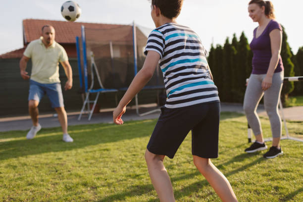 istock Family Playing Soccer 963103676