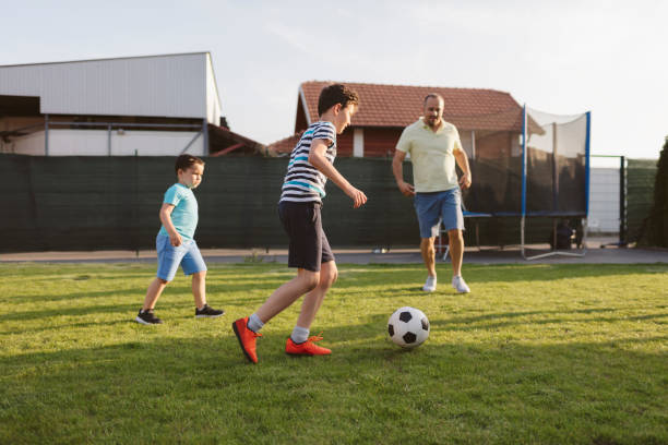 istock Family Playing Soccer 963103692