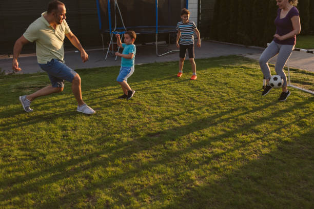 istock Family Playing Soccer 963103934