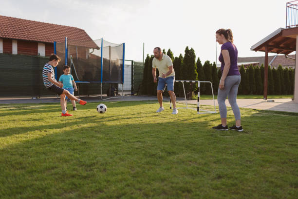 istock Family Playing Soccer 963104600