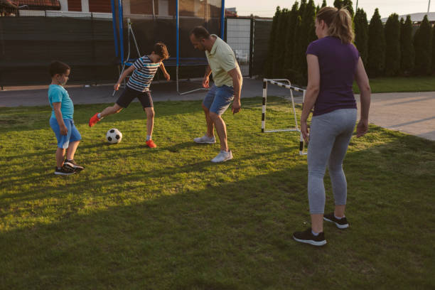 istock Family Playing Soccer 963104760