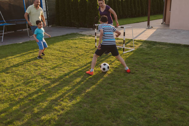 istock Family Playing Soccer 963105082