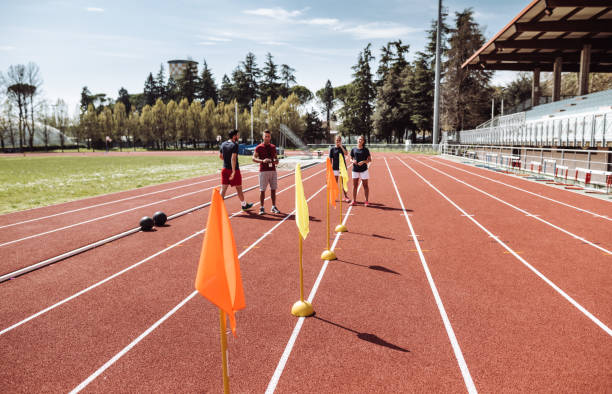 istock friends running on the track field 963108262