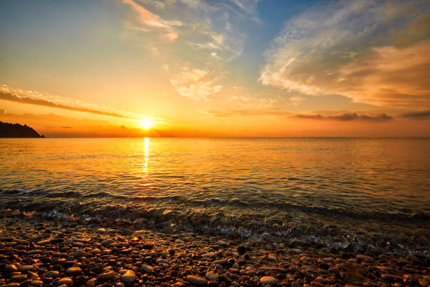 istock Beautiful view from the beach at the seaside with clouds at sunset. 963111372