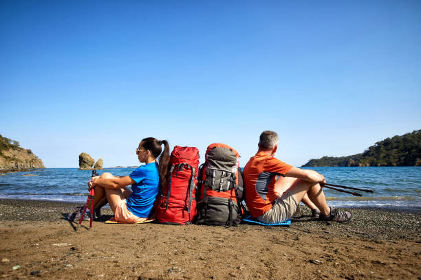 istock Adventure trek along the coast with a backpack in the summer. 963114170