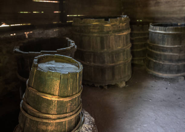 old worn-out wooden barrels in a barn