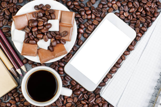 istock Contemporary wooden desktop with workplace and coffee 963115852