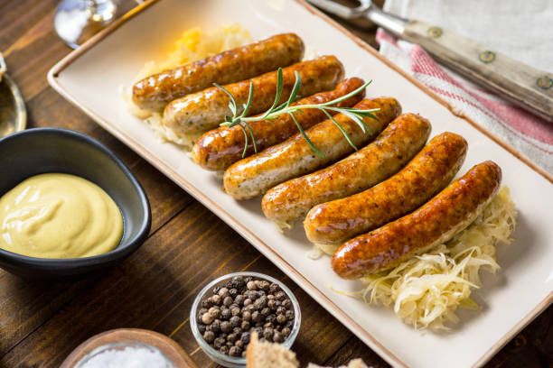 istock Juicy Grilled Sausages with Cabbage Salad, Mustard and Beer 963116426