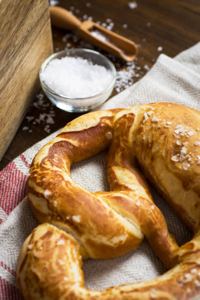 istock Bavarian Fresh Pretzel with Sea Salt on Rustic Background 963121424