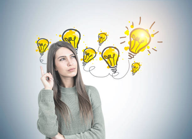 istock Thoughtful woman in green pointing up, brainstorm 963122568