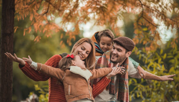 istock Young happy parents having fun with their small kids in nature. 963122668