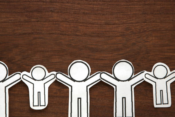 istock Human paper cut illustration vector on brown wood.  Teamwork concept. Social Network concept. 963123004