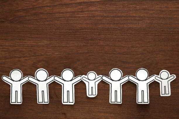 istock Human paper cut illustration vector on brown wood.  Teamwork concept. Social Network concept. 963123026