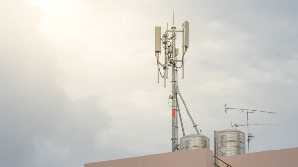istock Telecommunication Tower. Cell Phone Signal Tower on sky background 963123038