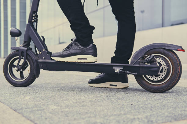 istock Cropped image of a man on an electric scooter. 963123068