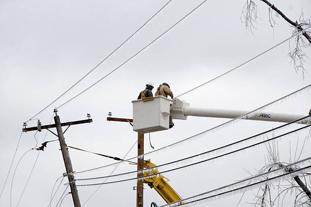 Electric Crews Work to Restore Power stock photo