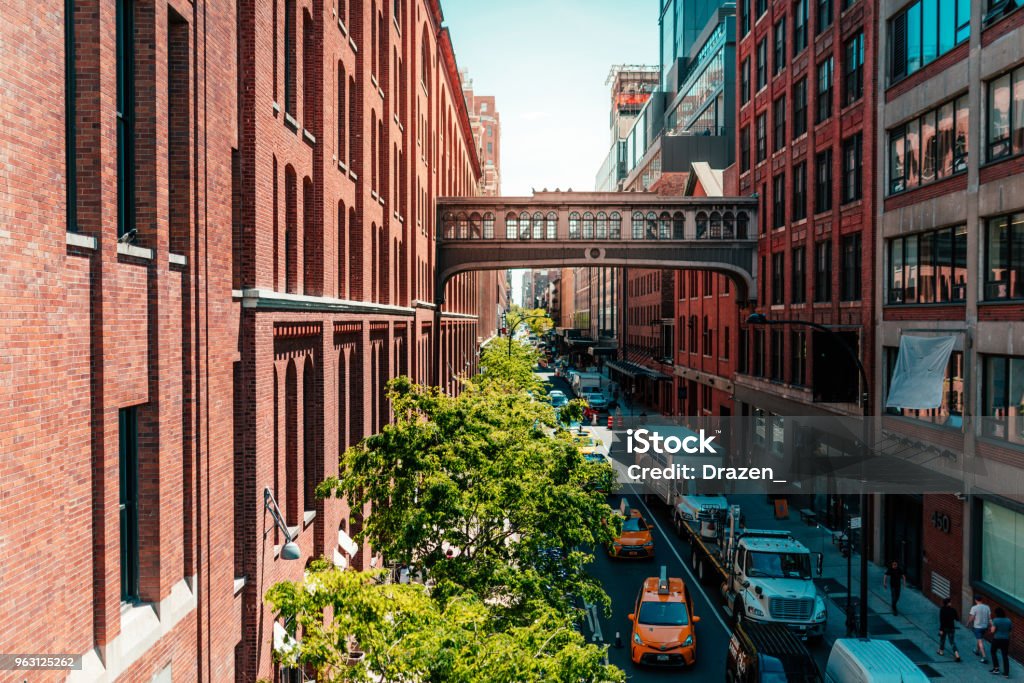 Old street in the Lower Manhattan near the High Line The most famous and fabulous city in the world - New York City as unique lifestyle, architecture and landmarks. High Line Park Stock Photo