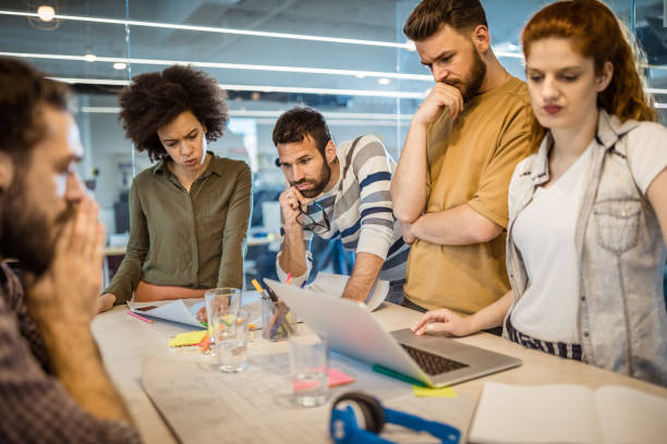 istock Group of worried freelance workers having problems in the office. 963126328