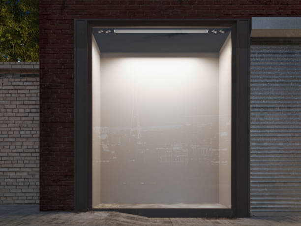 istock Blank shop window in the night street with light on the frame. 3d rendering 963126746