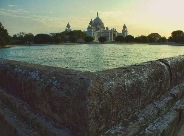 The Victoria Memorial is a large marble building in Kolkata, West Bengal, India, which was built between 1906 and 1921. It is dedicated to the memory of Queen Victoria(1819–1901) and is now a museum and tourist destination under the auspices of the Ministry of Culture.The memorial lies on the Maidan (grounds) by the bank of the Hooghly River, near Jawaharlal Nehru Road (better known as Chowringhee Road).