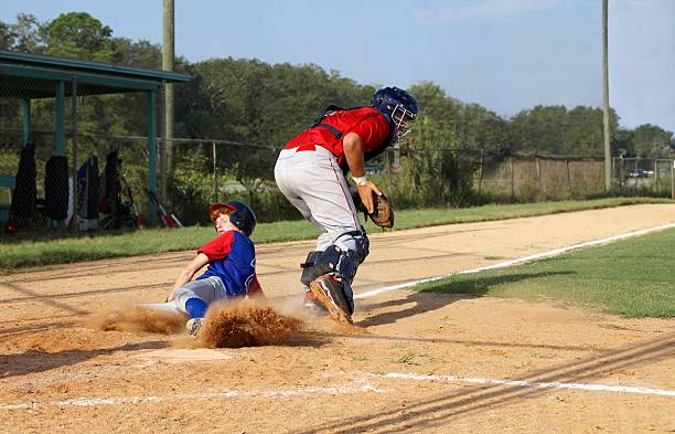 安全ご自宅で - baseball baseball player base sliding ストックフォトと画像