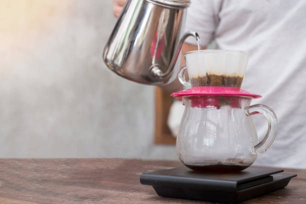istock Drip brewing, filtered coffee, roasted, ground coffee beans contained , drip coffee background 963133628