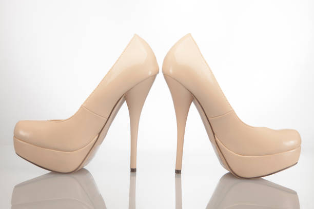 A high heel studio shot for object with red background