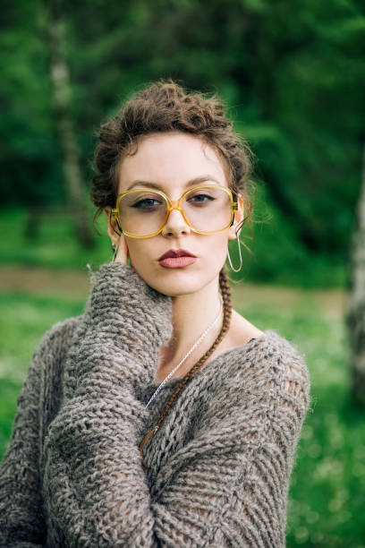 istock Pretty young woman with eyeglasses in the forest 963137746